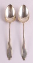A pair of second grade 835/1000 silver vegetable serving spoons, point fillet, i