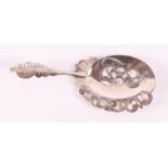 A silver wet fruit scoop with hammered decoration. YES. Melis, Den Bosch.