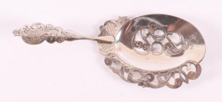 A silver wet fruit scoop with hammered decoration. YES. Melis, Den Bosch.