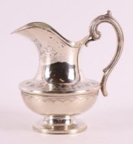 A silver milk jug, 20th century.