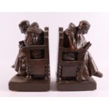 A pair of plaster bookends in the shape of sitting monks, 20th century