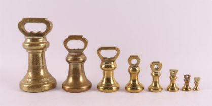 A set of eight bronze English bell weights, 19th century.