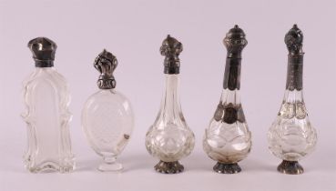 A lot of five various odeur bottles with silver frames, 19th century.