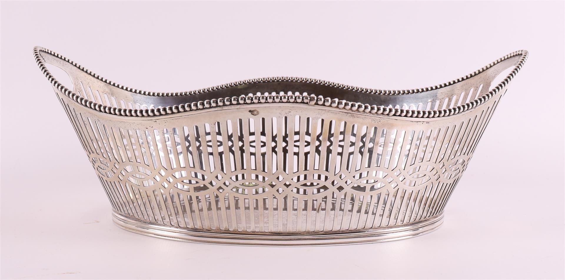 A silver openwork boat-shaped chocolate basket, year letter 1911. - Image 2 of 9