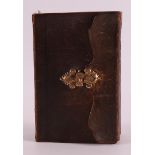 A Bible/psalm book in brown leather binding and 14 kt gold clasp, around 1900.