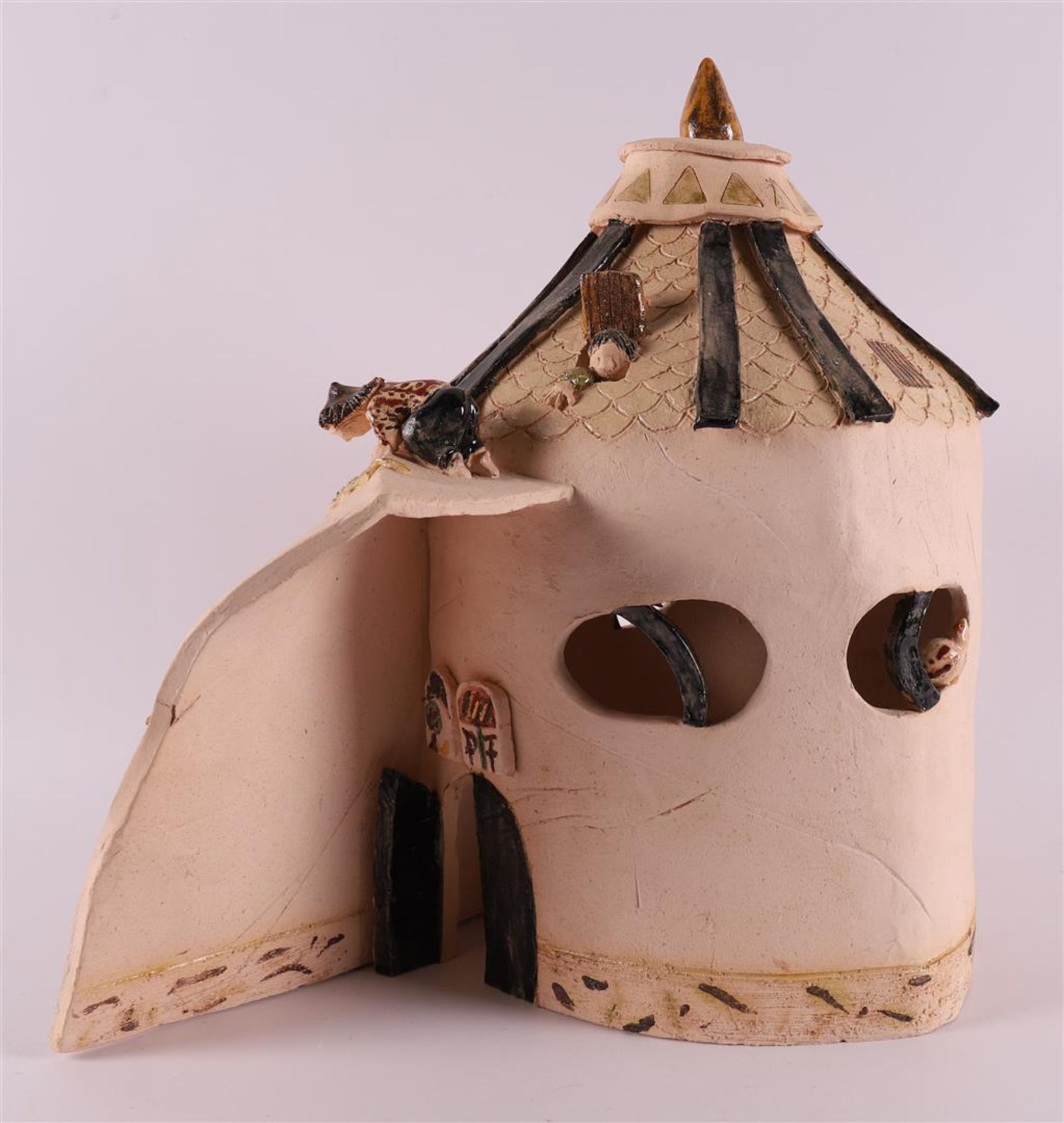 A ceramic sculpture of children near a tent, modern/contemporary.