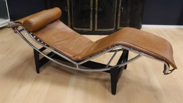 A chrome-plated tubular frame lounge chair, in the style of Le Corbusier.