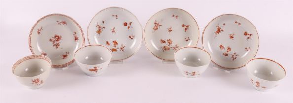 Three porcelain milk and blood 'rouge de fer' cups and saucers, China, Qianlong