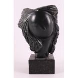 Dael, van Monica (Rotterdam 1943) A bronze head of a woman.