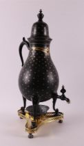 A pear-shaped black lacquered pewter tap jug, 19th century.