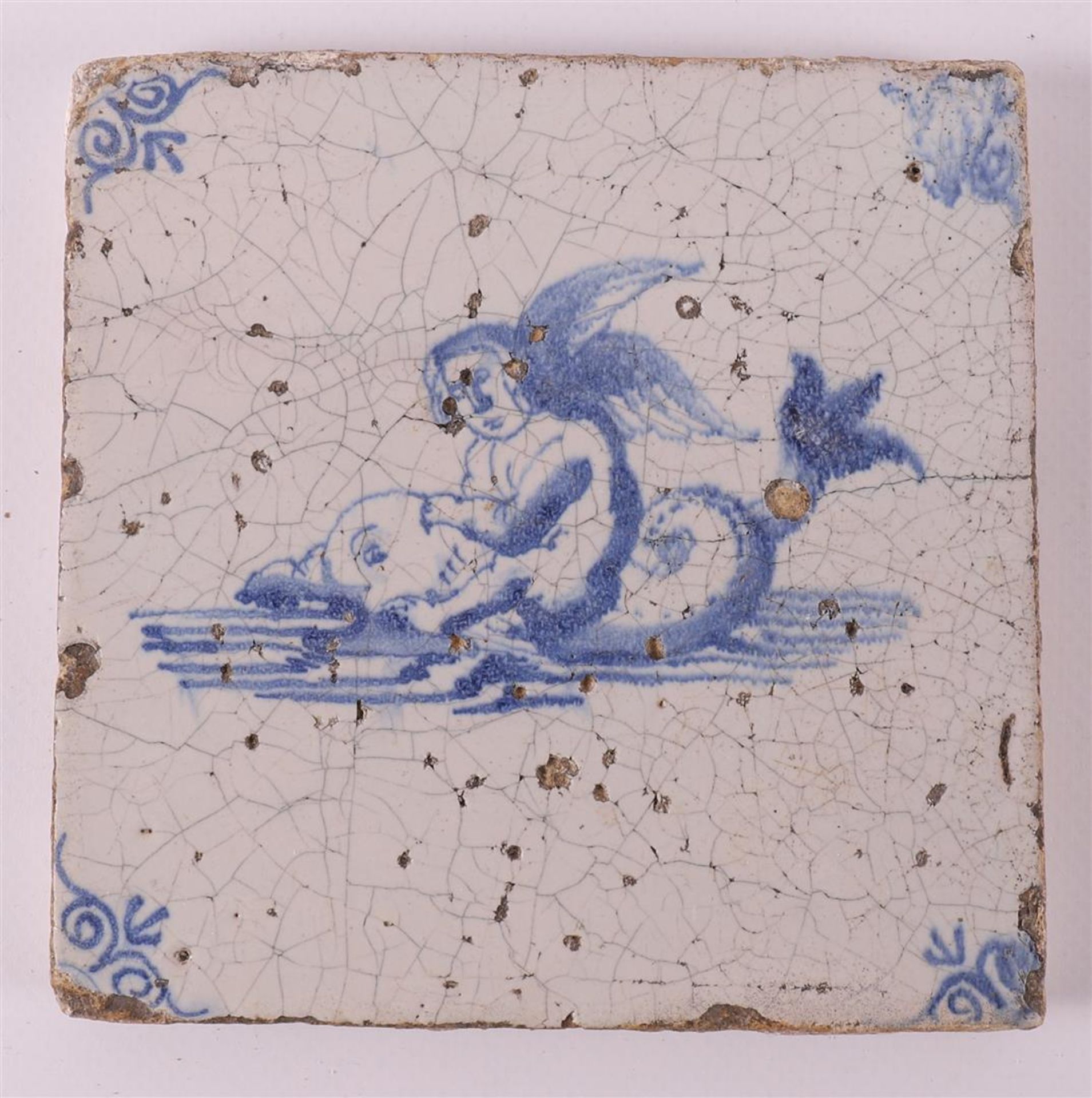 A blue/white tile with a decor of putti on a dolphin, Holland, 17th century - Image 2 of 6