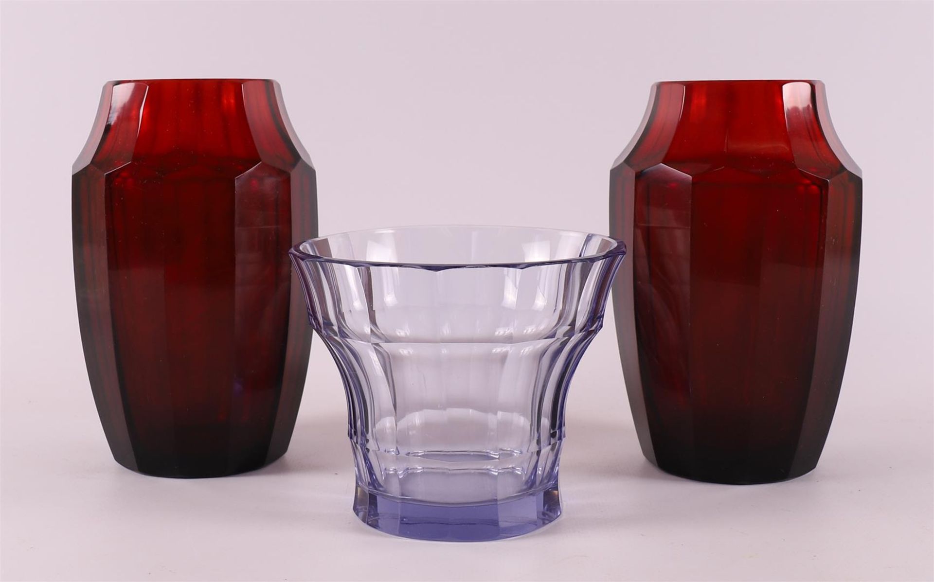 A pair of red glass faceted Art Deco vases, executed by Moser, ca. 1930.