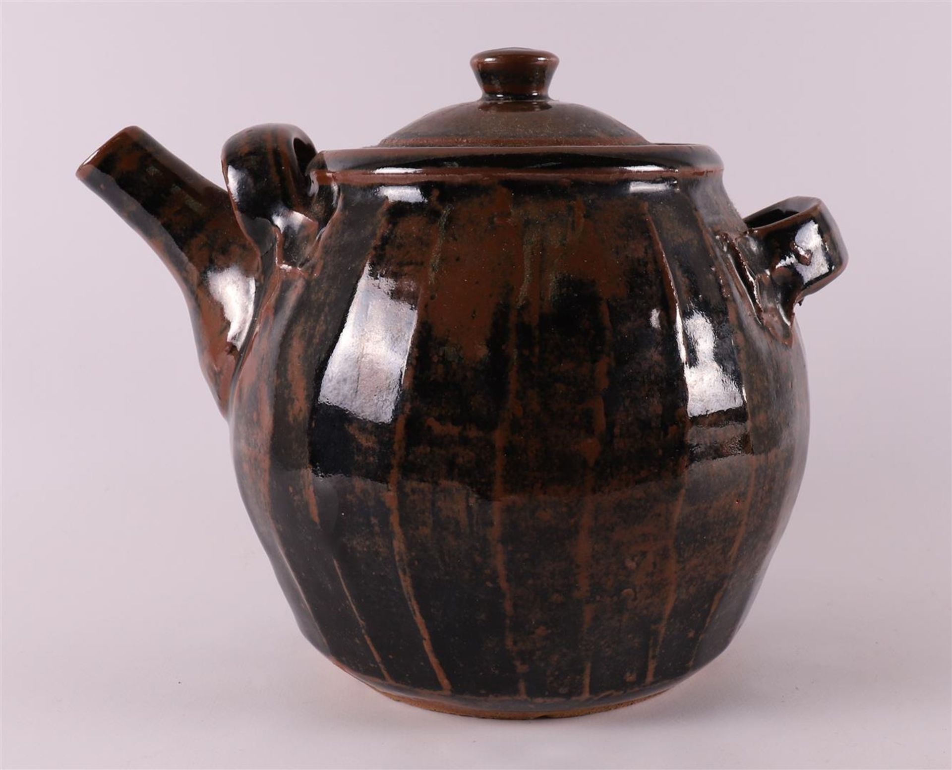 A brown glazed ceramic teapot, 2nd half of the 20th century.
