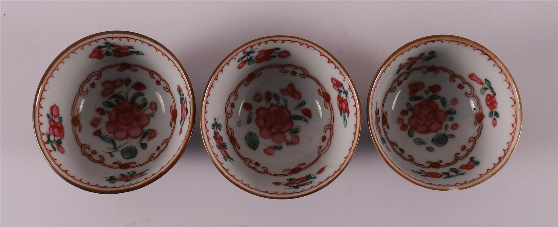 Three famille rose cups and saucers on capucine ground, China, Qianlong, 18th ce - Image 7 of 9
