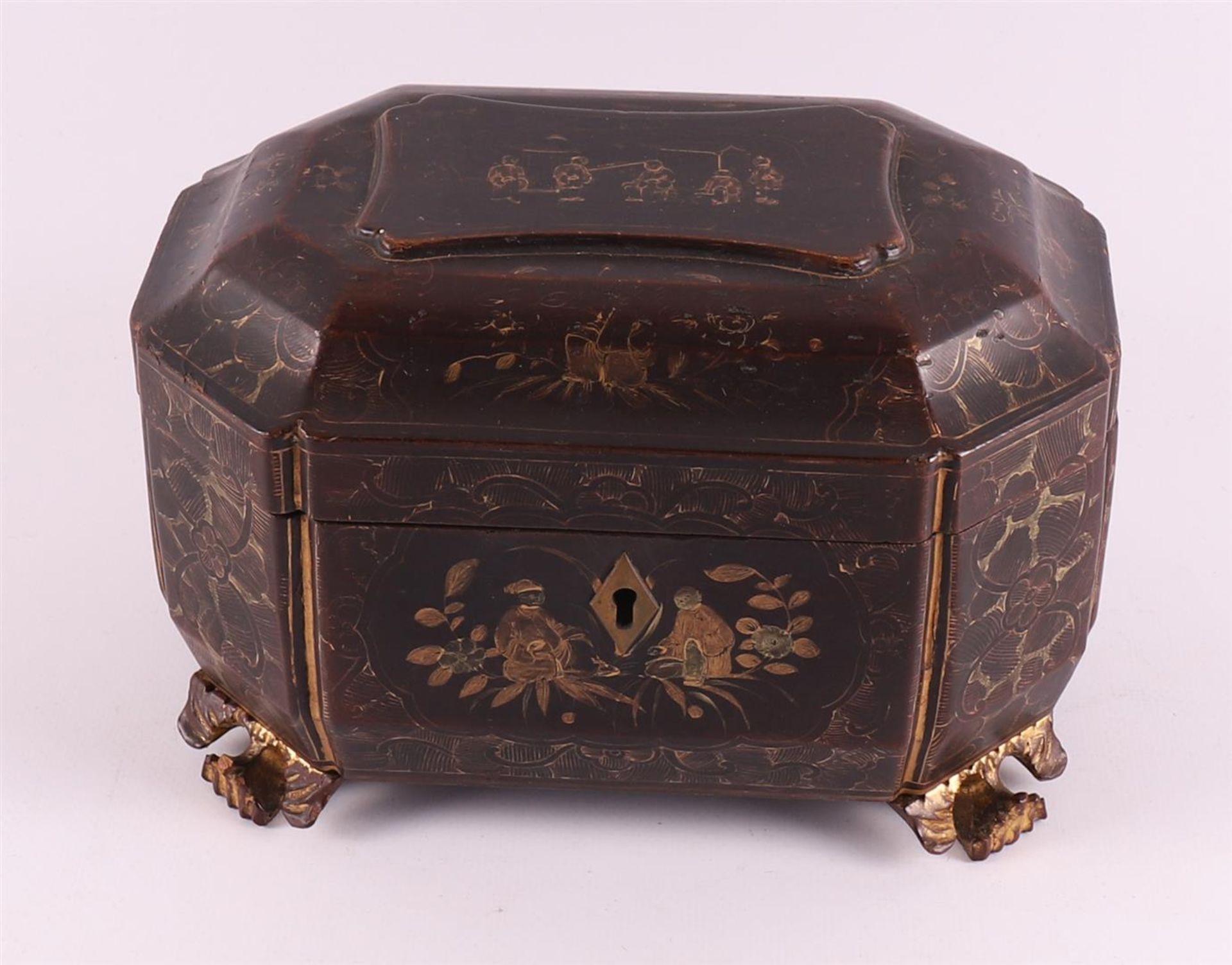 A gold-coloured decorated Chinese black lacquer tea chest, Qing dynasty,