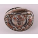 A porcelain Japanese Imari plate with silver handle, Japan, Edo, around 1700.