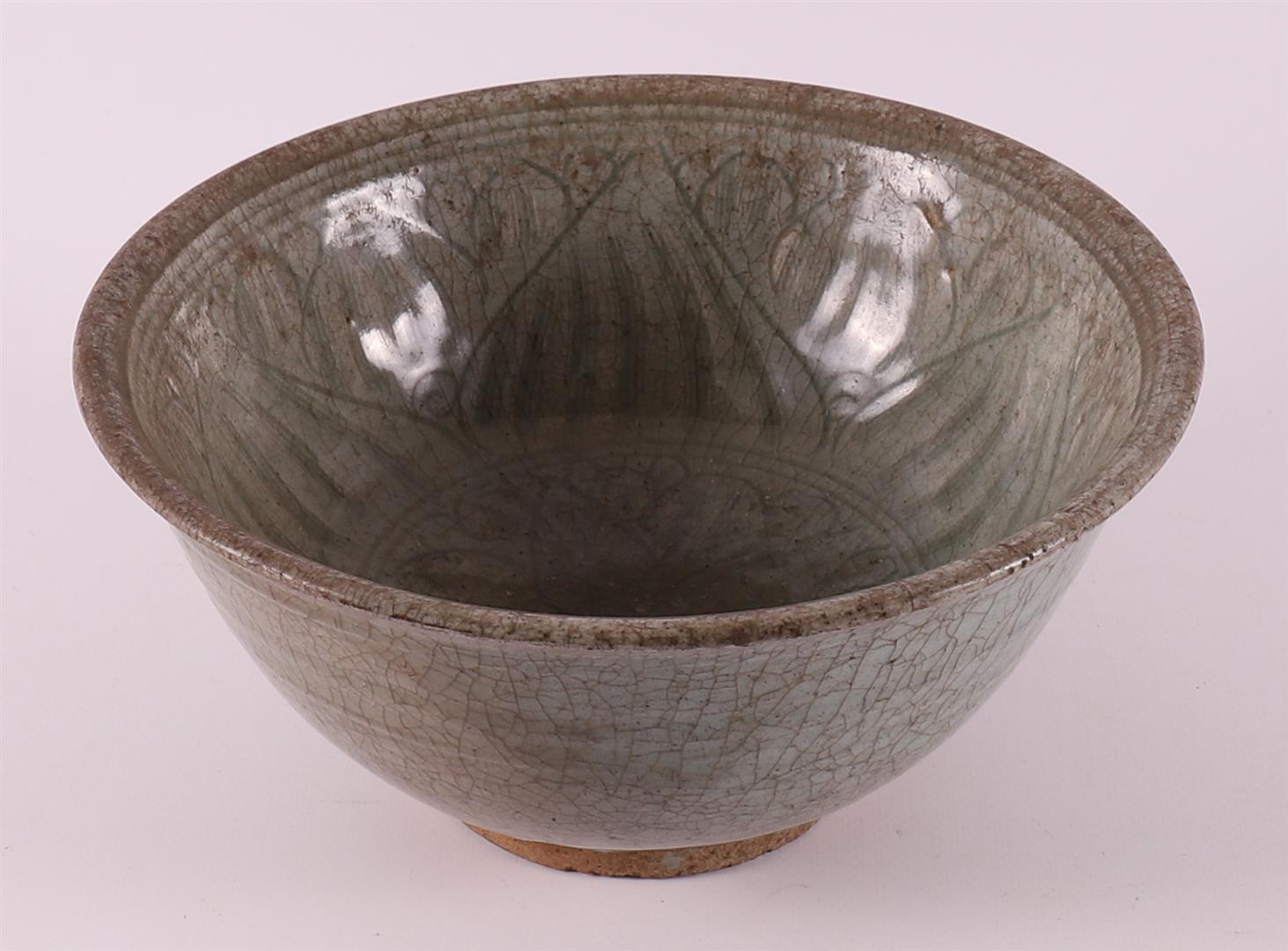 A celadon-glazed stoneware bowl, China, Song Dynasty (960-1279).