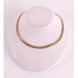 A 14 kt 585/1000 partly openwork gold choker.