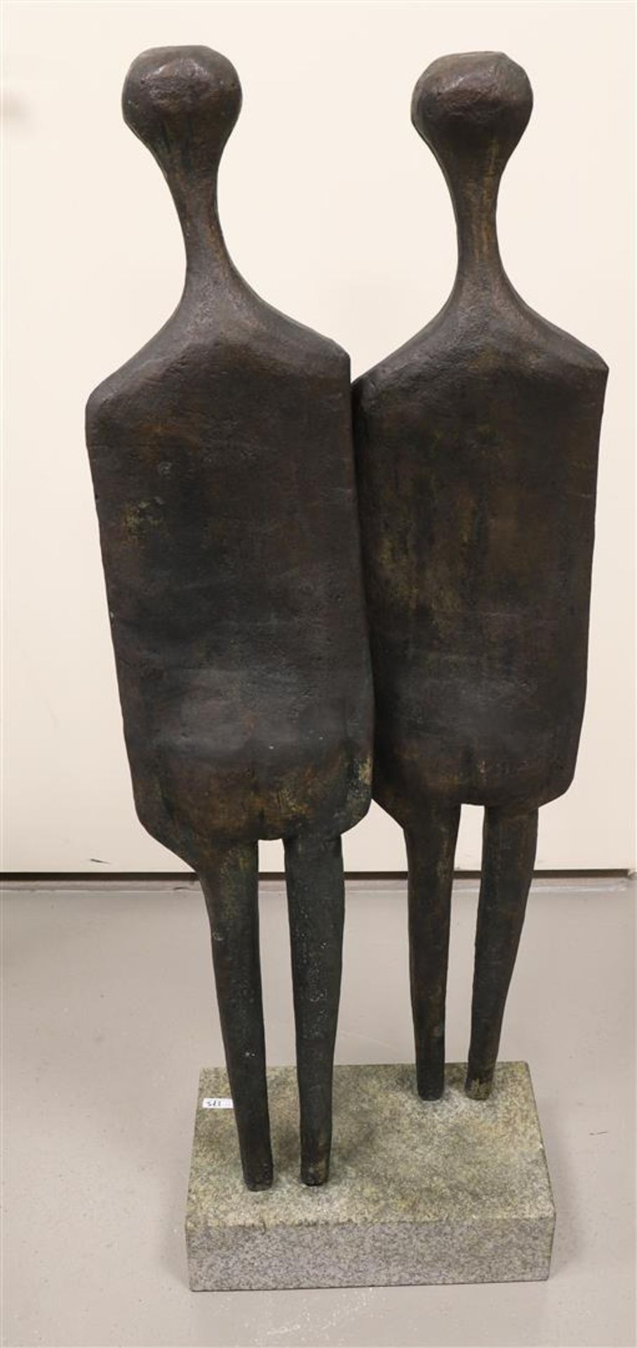 A brown patinated bronze pair of standing figures on a natural stone base. - Image 2 of 2