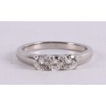 A platinum 950/1000 row ring set with three diamonds of approximately 0.2 crt ea