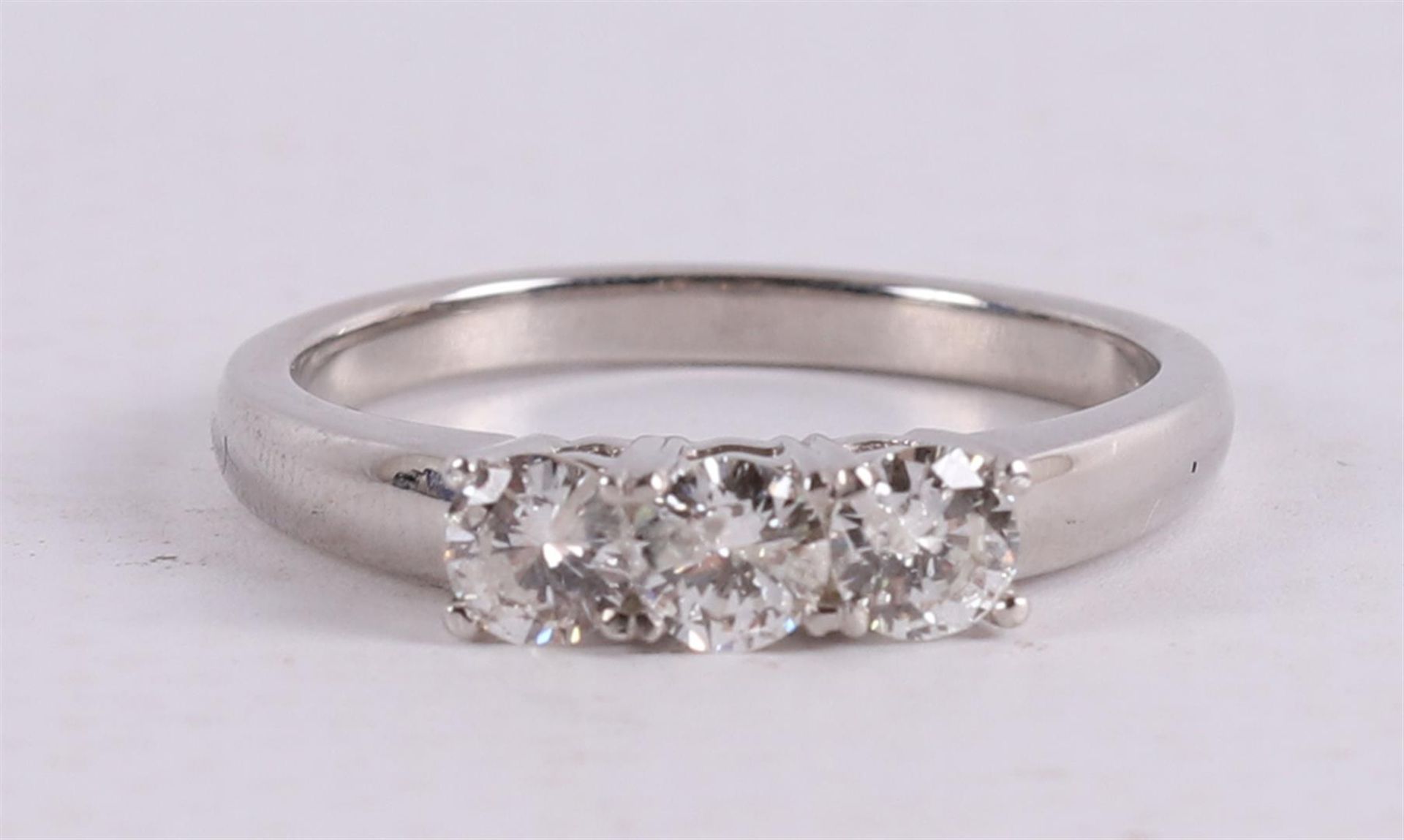 A platinum 950/1000 row ring set with three diamonds of approximately 0.2 crt ea