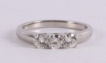 A platinum 950/1000 row ring set with three diamonds of approximately 0.2 crt ea