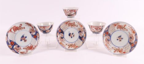 Three porcelain Imari cups and saucers, Japan, Edo, 18th century.