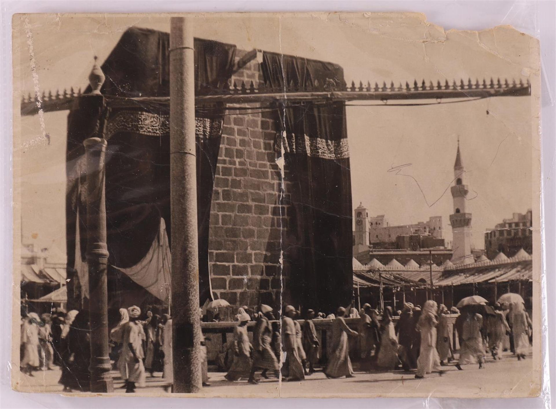 A black and white photo of the Kaaba at Mecca, dated 1914