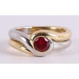 A 14 kt yellow gold and platinum impact ring, set with faceted red spinel.