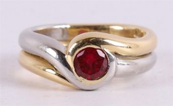 A 14 kt yellow gold and platinum impact ring, set with faceted red spinel.
