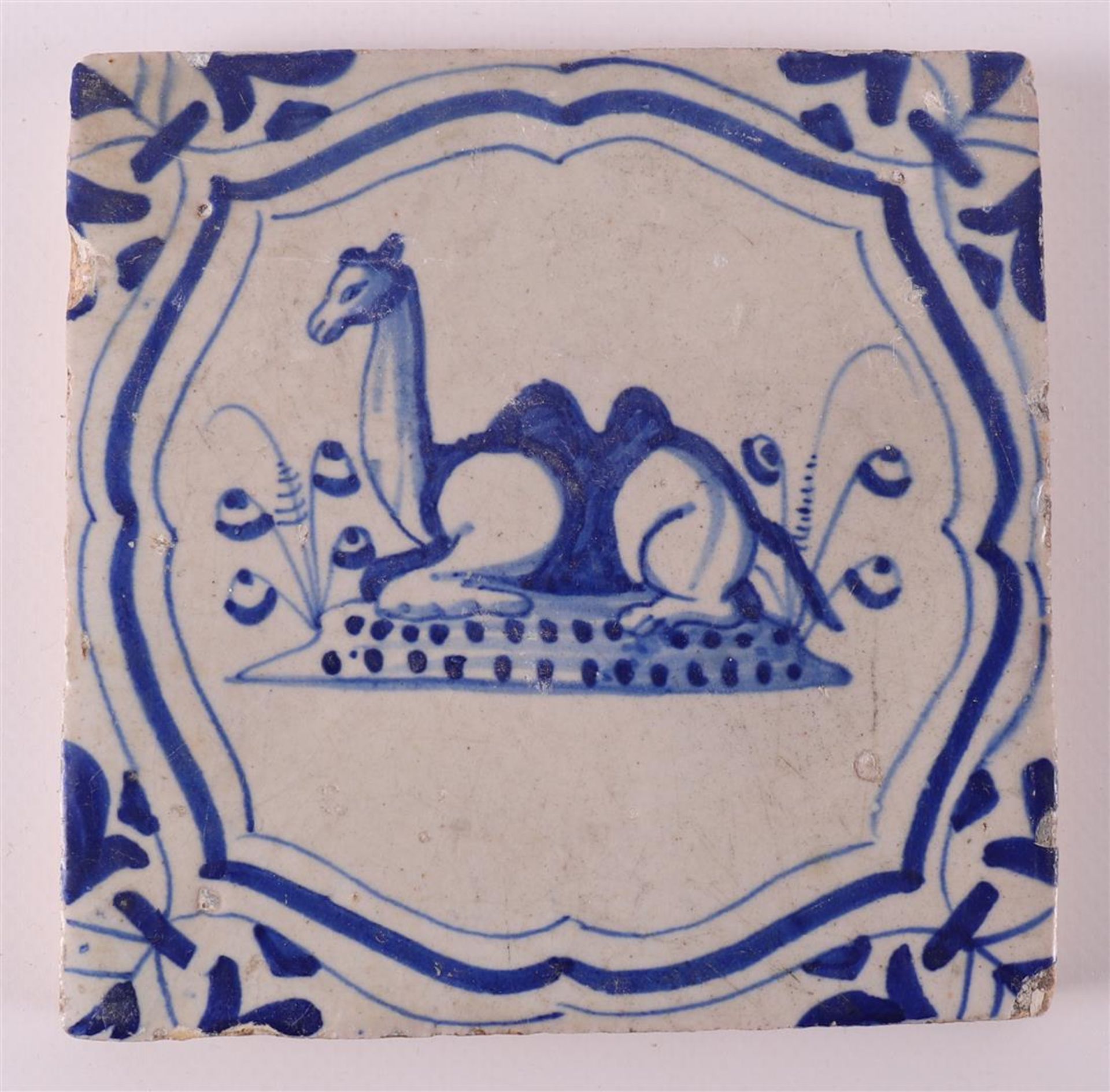 A blue/white tile with a decor of putti on a dolphin, Holland, 17th century - Image 5 of 6