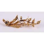 A 14 kt 585/1000 rose gold branch brooch, set with diamonds.