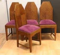 Four oak Amsterdam school dining room chairs, ca. 1920.