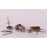 Etagere silver. Three various figures including fireplace set and wheelbarrow, 2