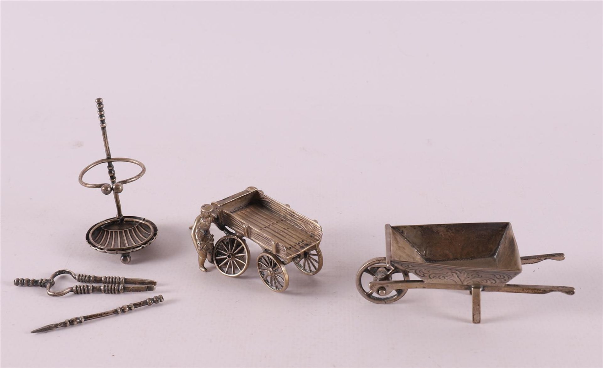 Etagere silver. Three various figures including fireplace set and wheelbarrow, 2
