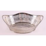 A silver openwork boat-shaped chocolate basket, year letter 1911.