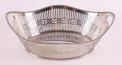 A silver openwork boat-shaped chocolate basket, year letter 1911.