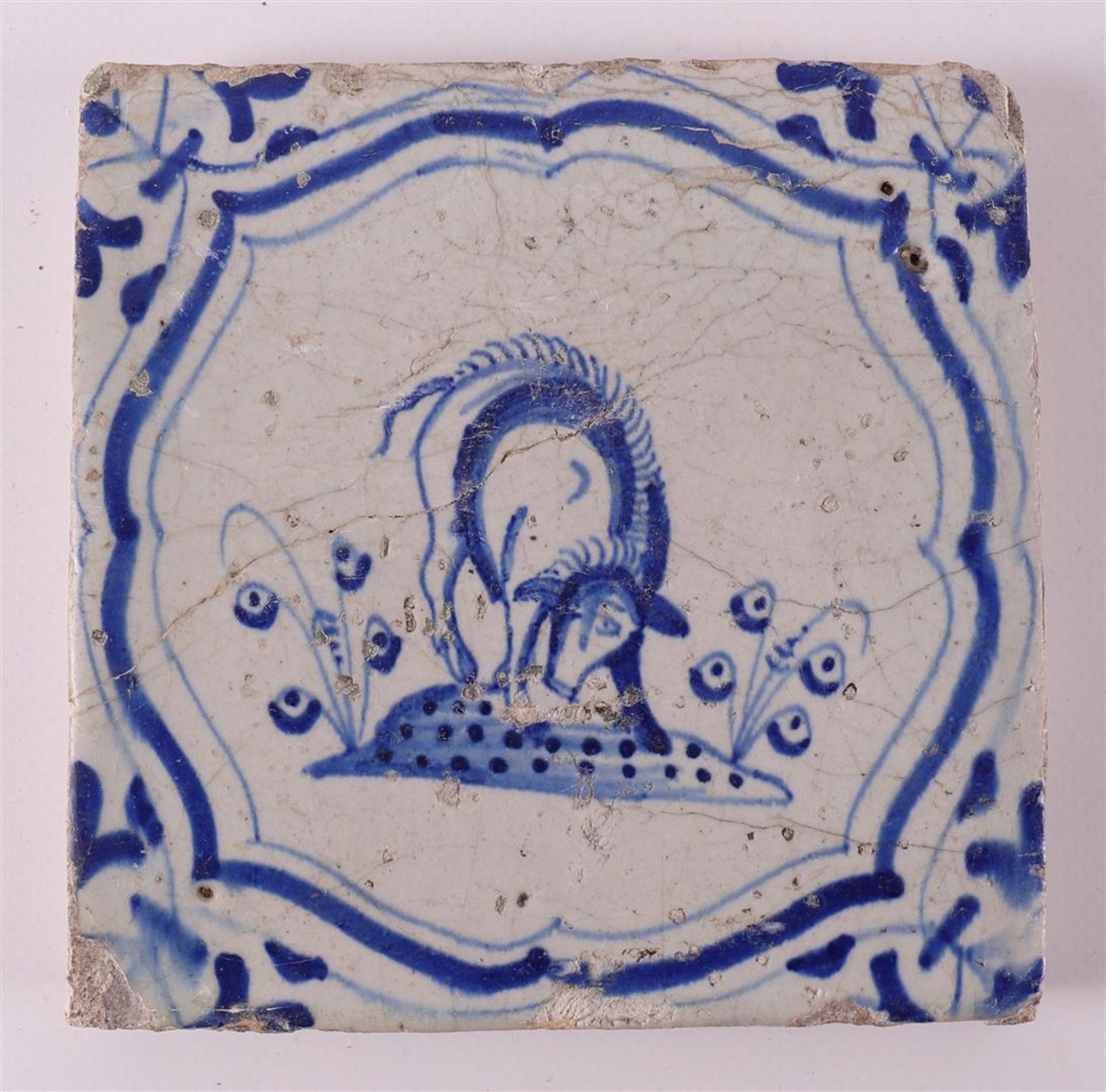 A blue/white tile with a decor of putti on a dolphin, Holland, 17th century - Image 3 of 6