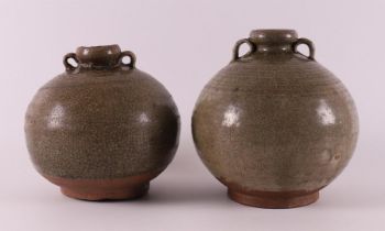 A pair of celadon glazed spherical vases with handles, China, Song Dynasty.