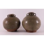 A pair of celadon glazed spherical vases with handles, China, Song Dynasty.