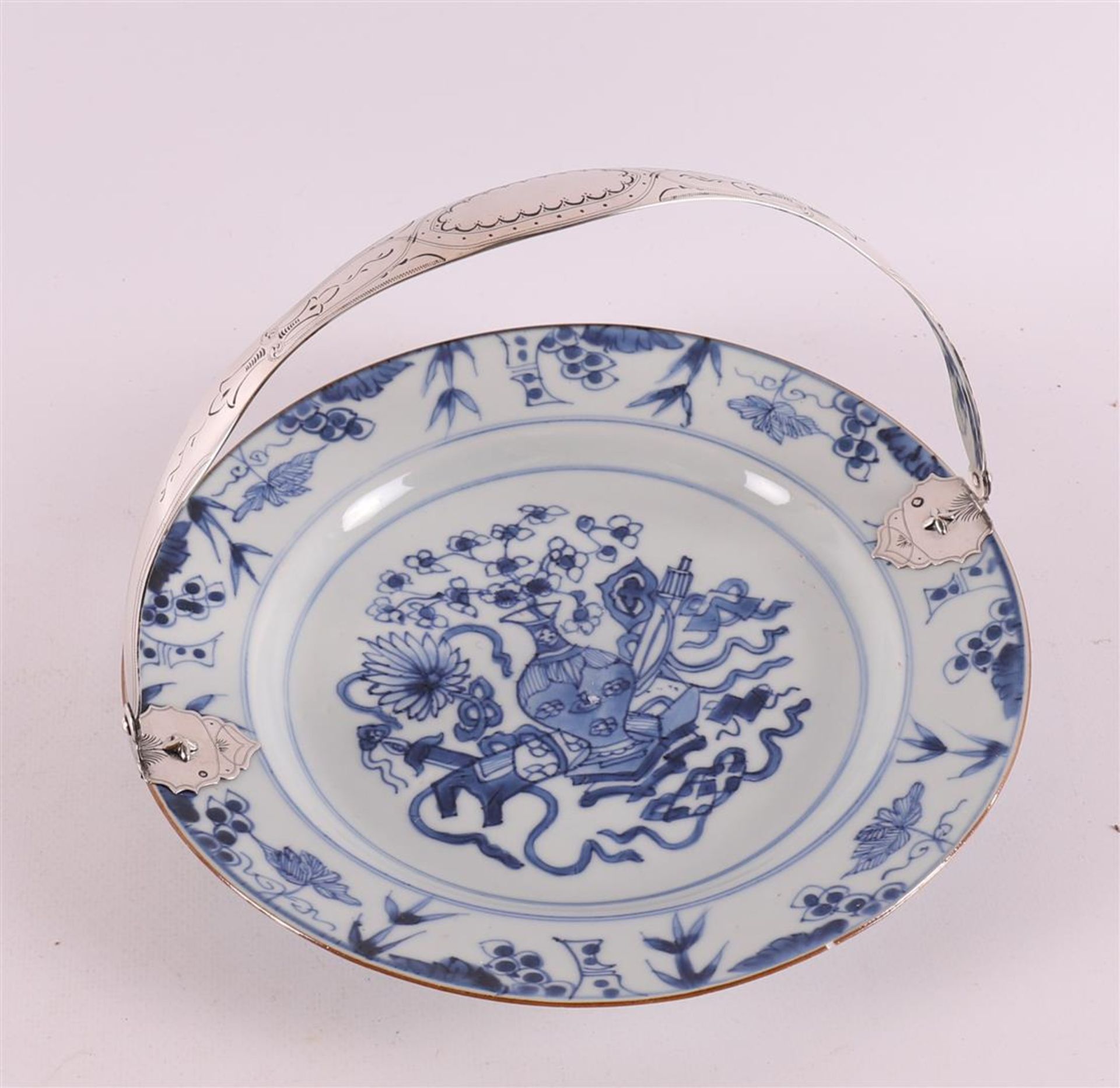 A blue/white porcelain plate with a silver handle from a later date, China, Kang