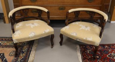 A pair of walnut bergères with yellow fabric upholstery, circa 1900