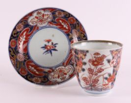 A porcelain Imari chocolate cup and saucer, Japan, 18th century.