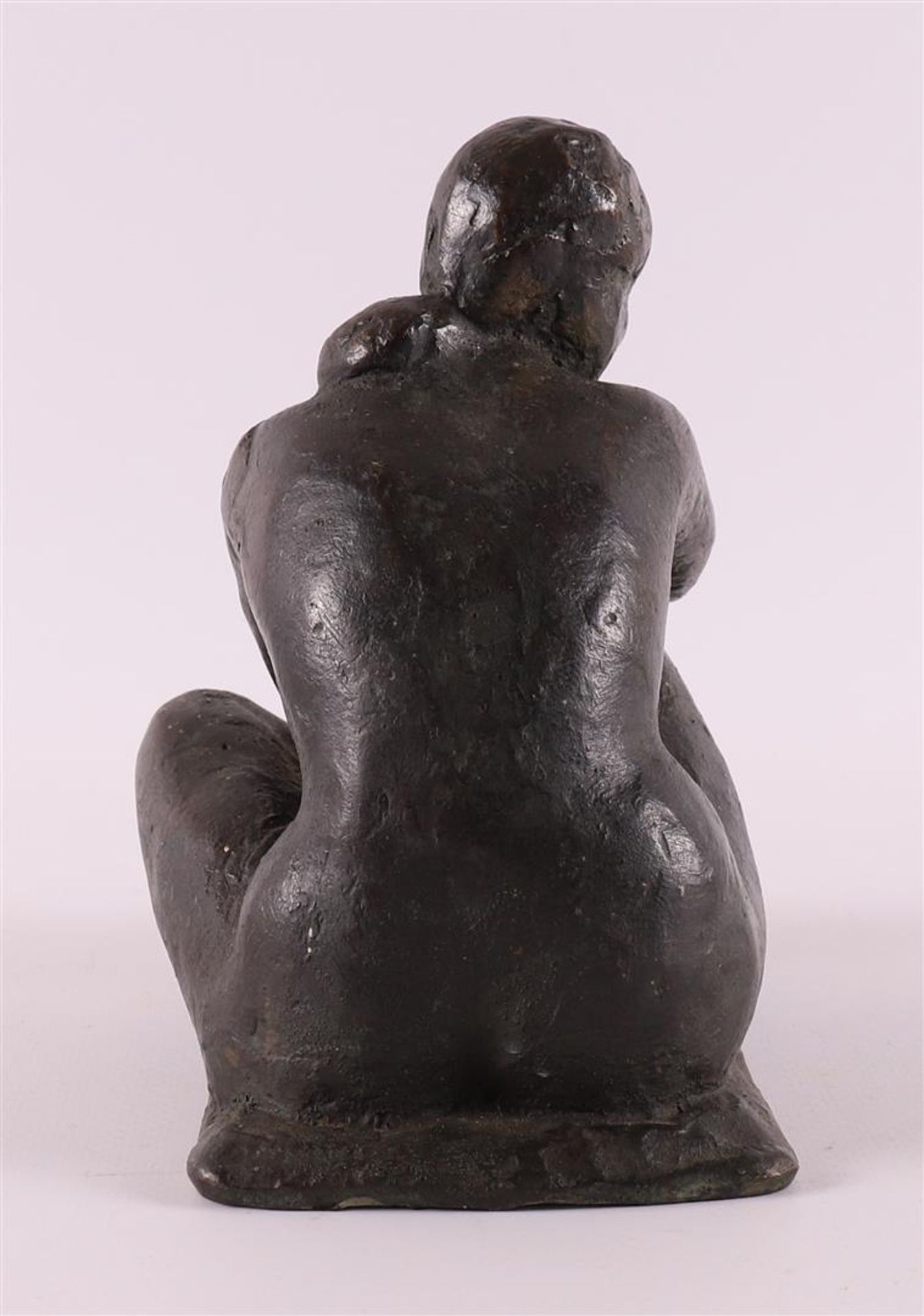 A brown patinated bronze sculpture of a seated female nude, 1918-1993. - Image 4 of 5