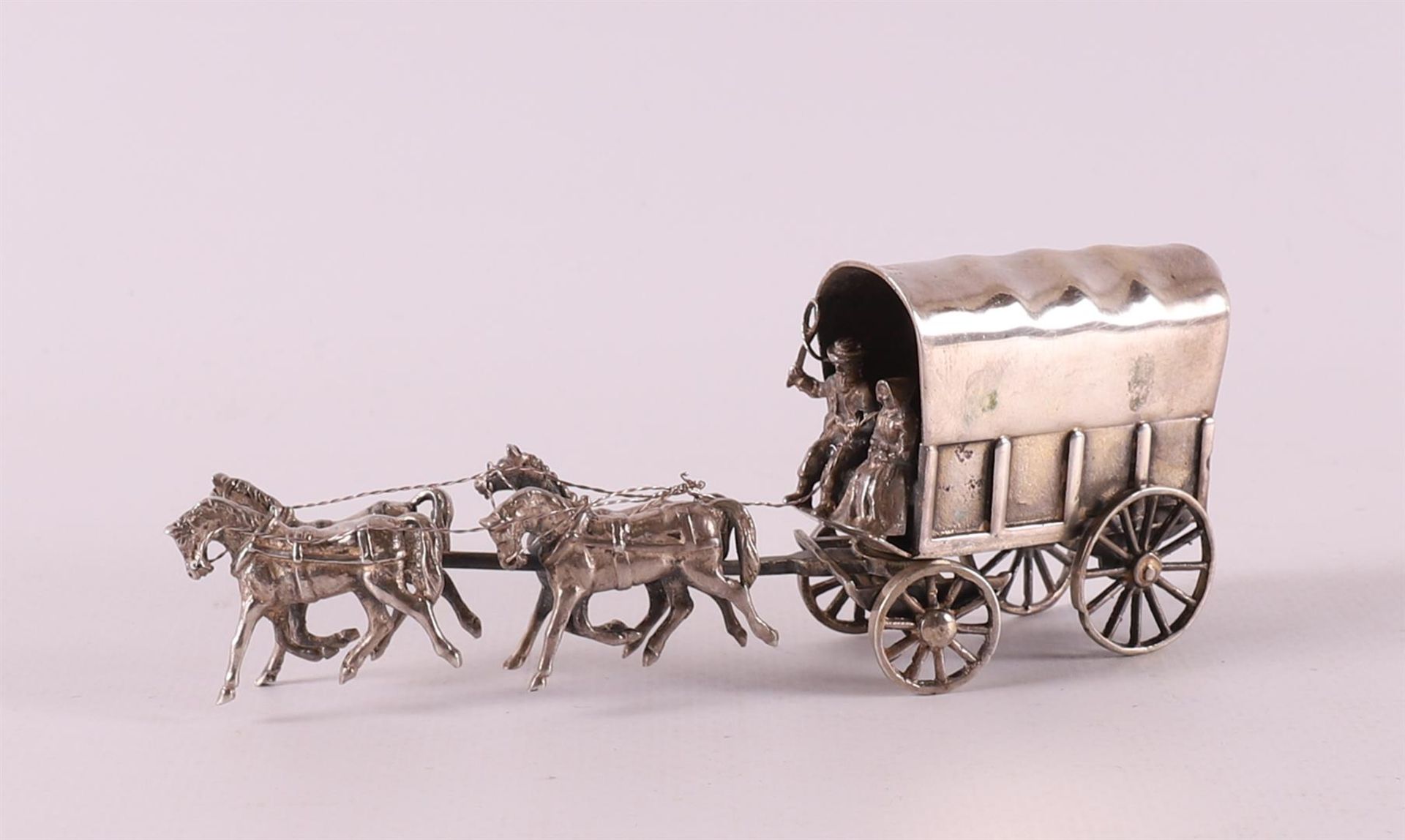 Etagere silver. An American covered wagon with four-horse team, 20th century