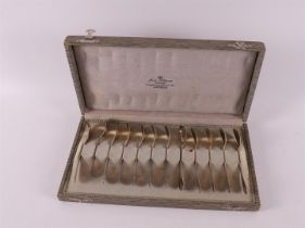 Twelve second grade silver Art Nouveau teaspoons in original case, 1900