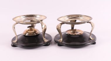 A set of silver tea stoves on black glass base, Netherlands, 19th century.