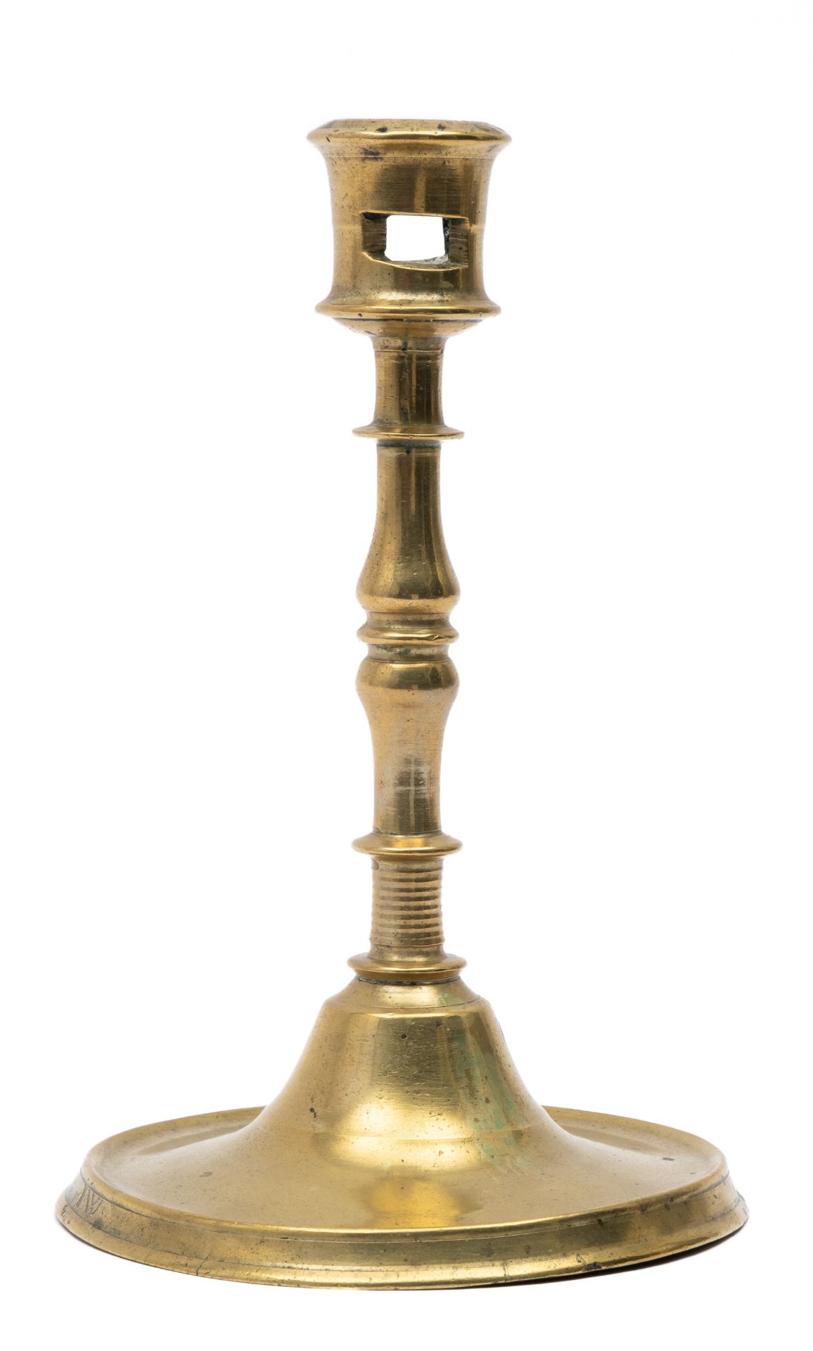 A Flemish brass candlestick