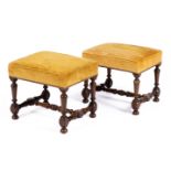 A pair of Louis XIV walnut stools