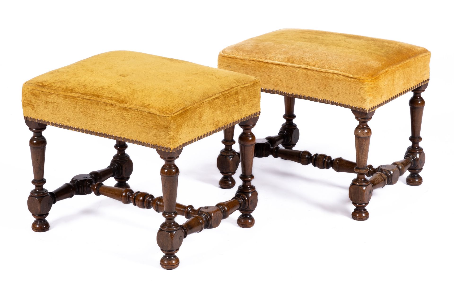 A pair of Louis XIV walnut stools